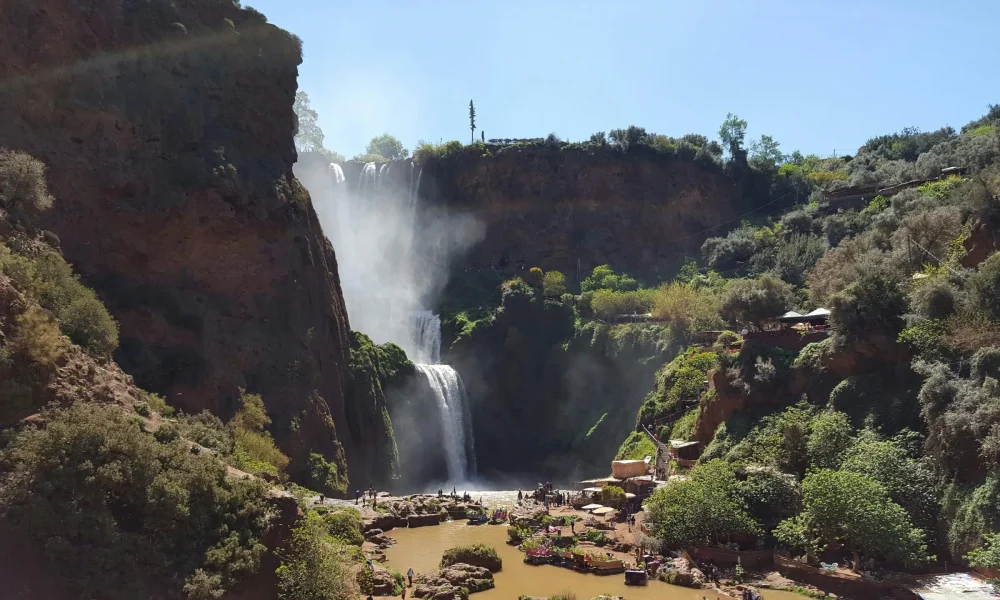 Scenic view of Ouzoud Waterfalls surrounded by lush greenery in Morocco.